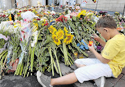 LET THERE BE LIGHT: Tributes outside the Dutch embassy in Kiev, Ukraine to the people who died when Flight MH17 was shot down