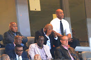 A file photo of Kaizer Chiefs' chairman Kaizer Motaung (L) , football manager Bobby Motaung (C) and former player Kaizer Motaung Jnr look on during a match. The Chiefs hierachy will be devastated with the decision. 