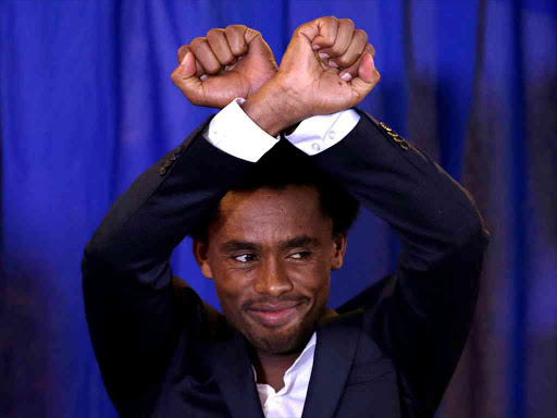 Rio Olympic marathon silver medal winner Feyisa Lilesa of Ethiopia arrives at a news conference in Washington, US, September 13, 2016. /REUTERS