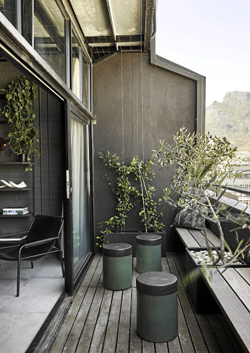 'I love sitting on the balcony with its olive trees and jasmine creeper looking out across the city towards Table Mountain,' says homeowner Kim Smith.