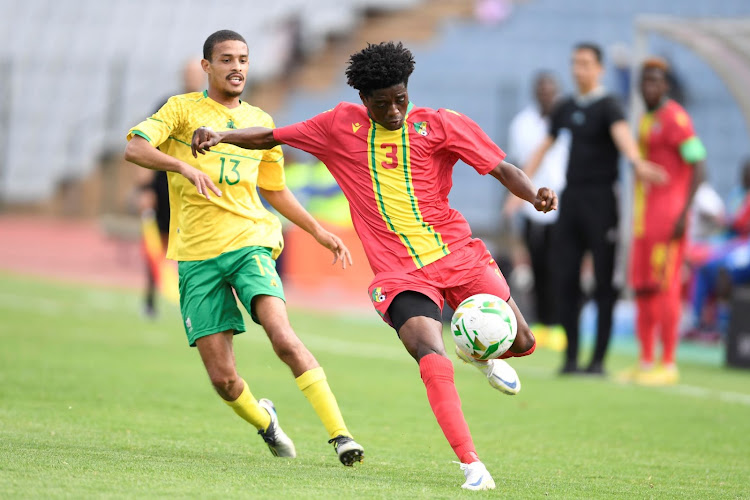 Devin Titus with Djigo Saikou of Congo Brazzaville during the U23 Africa Cup of Nations qualifier at Donsonville Stadium on March 23 2023.