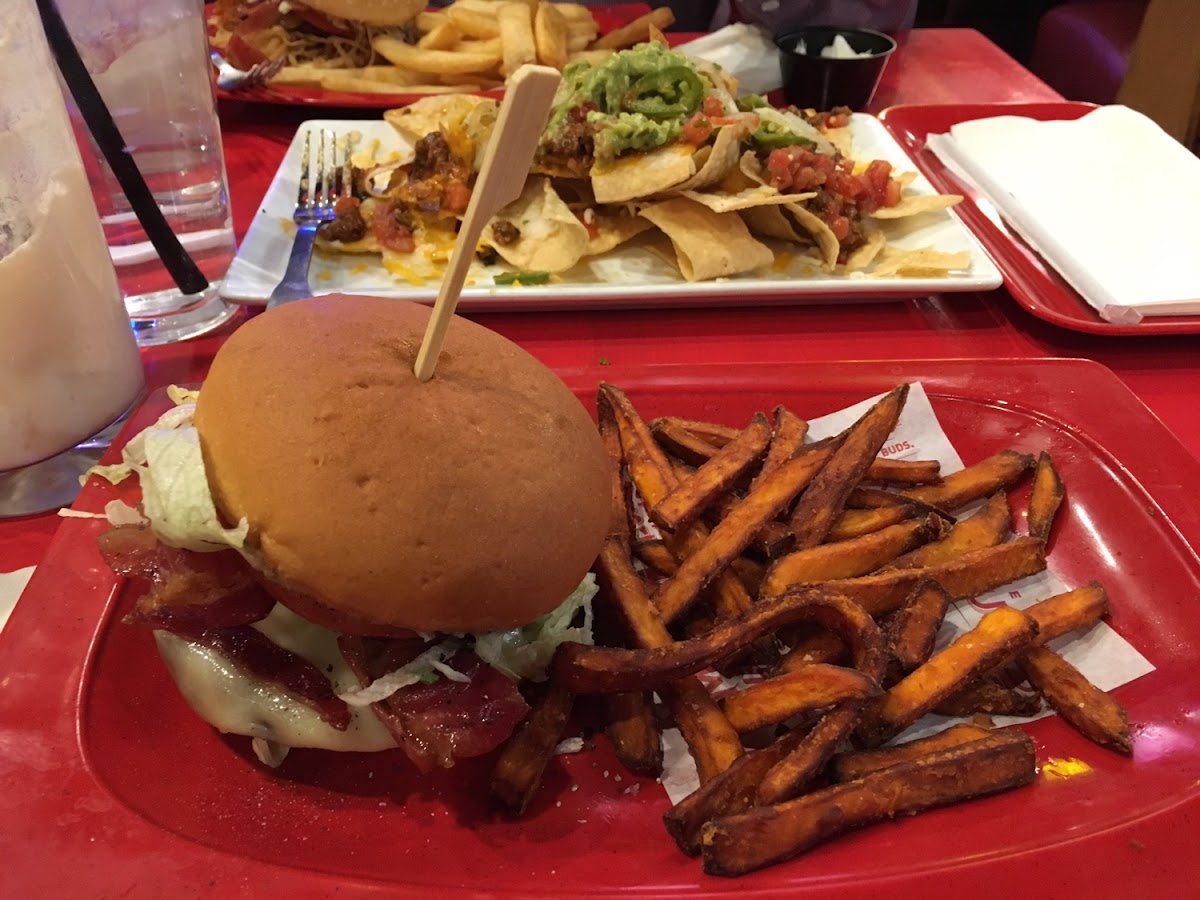 Loving the guacamole bacon burger, nachos and my husband's steak fries!