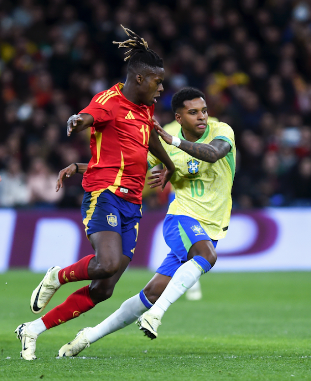 Spain's Nico Williams (L) vies with Brazil's Rodrygo (front R) in a past international friendly football match in Madrid, Spain last month