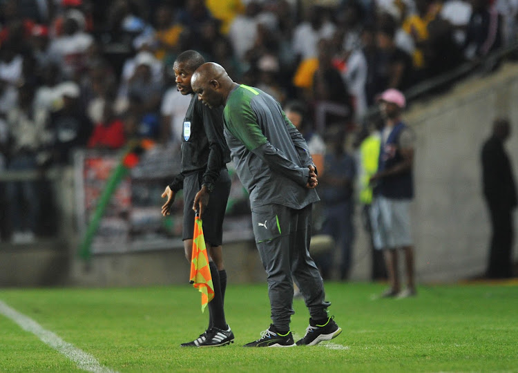 Pitso Mosimane engages to a fourth official during the match against Orlando Pirates at Orlando Stadium on January 15 2020.