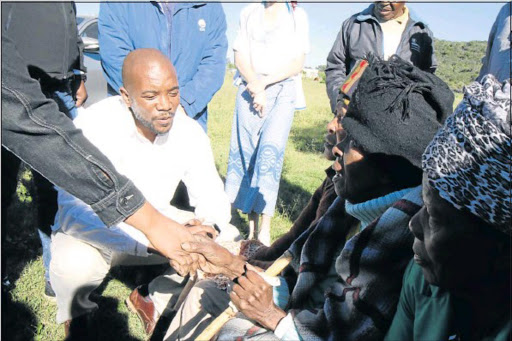 HELPING HAND: DA leader Mmusi Maimane chats to farm dwellers during his visit to Komani Picture: TEMBILE SGQOLANA