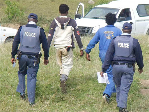 ARRESTS: Knobkerrie-wielding Masifunisane Association members handed these men over to the police on Sunday Picture: SIKHO NTSHOBANE