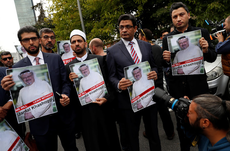 Human rights activists and friends of missing Saudi journalist Jamal Khashoggi held his picture during a protest outside Saudi Arabia's consulate in Istanbul, Turkey on Saturday.