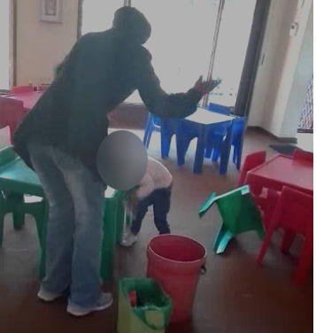 A video of a child being hit by a teacher because she vomited has caused outrage on social media.