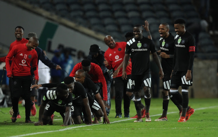 Orlando Pirates' striker Bernard Morrison celebrates with teammates after scoring his second goal in a 2-0 Nedbank Cup Last 32 win over Ajax Cape Town at Orlando Stadium on February 10, 2018 in Johannesburg, South Africa.