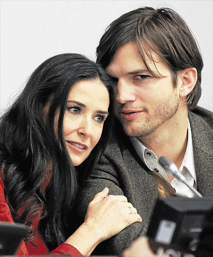 Actress Demi Moore and her husband, actor Ashton Kutcher, at a news conference in November. Rumours abound that their marriage is on the rocks Picture: BRENDAN MCDERMID/REUTERS