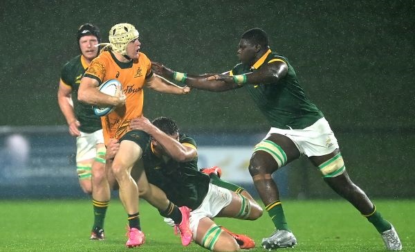 Angus Staniforth of Australia is tackled while Bathobele Hlekani gives chase during the Under-20 Rugby Championship match against SA at Sunshine Coast Stadium on Tuesday. Picture: ALBERT PEREZ/GETTY IMAGES