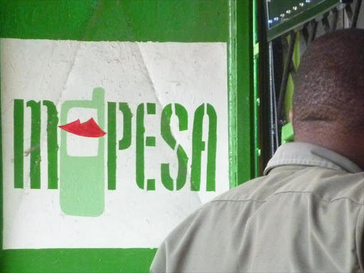 TARGETED: Clients queuing for an M-Pesa agent along Baluchi street Mombasa.Photo/Elkana Jacob