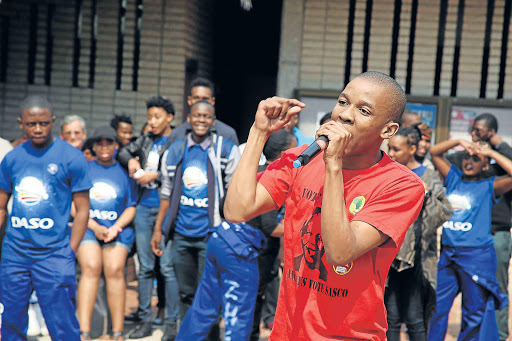 TAKING A STAND: Different organisations campaigned for the upcoming NMMU SRC elections at the NMMU South Campus recently. Here Sasco presidential candidate Lufefe Mkutu shares his views Picture: EUGENE COETZEE