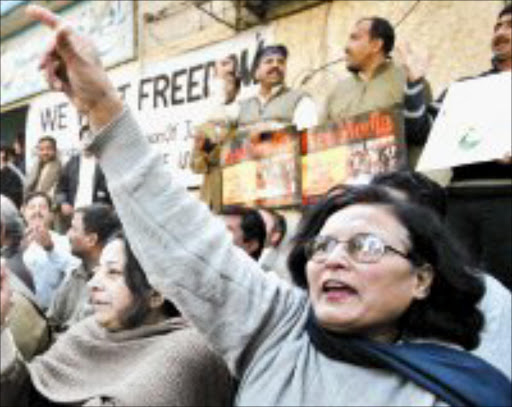 ANGER: Pakistani journalists protesting against media curgs. Pic. Mian Khursheed. 21/11/07. © Reuters.