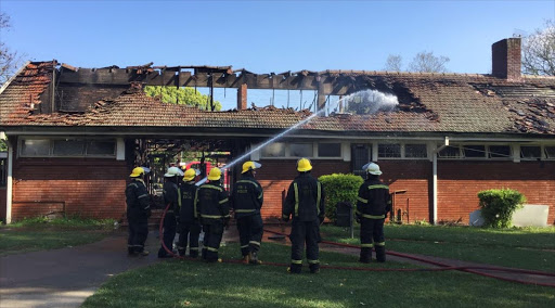 Firefighters extinguish the fire at the William O Brien Res at the University of KwaZulu-Natal campus in Pietermaritzburg