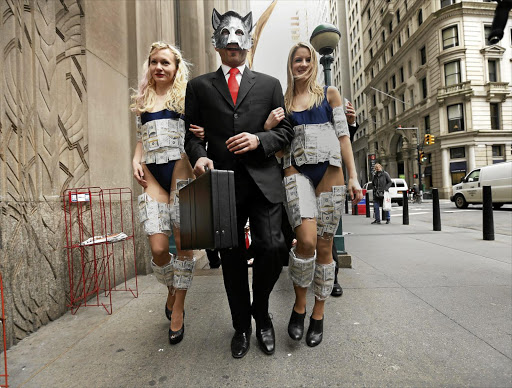 Models stage a publicity stunt in New York to mark the DVD release of ‘The Wolf of Wall Street’ three years ago.