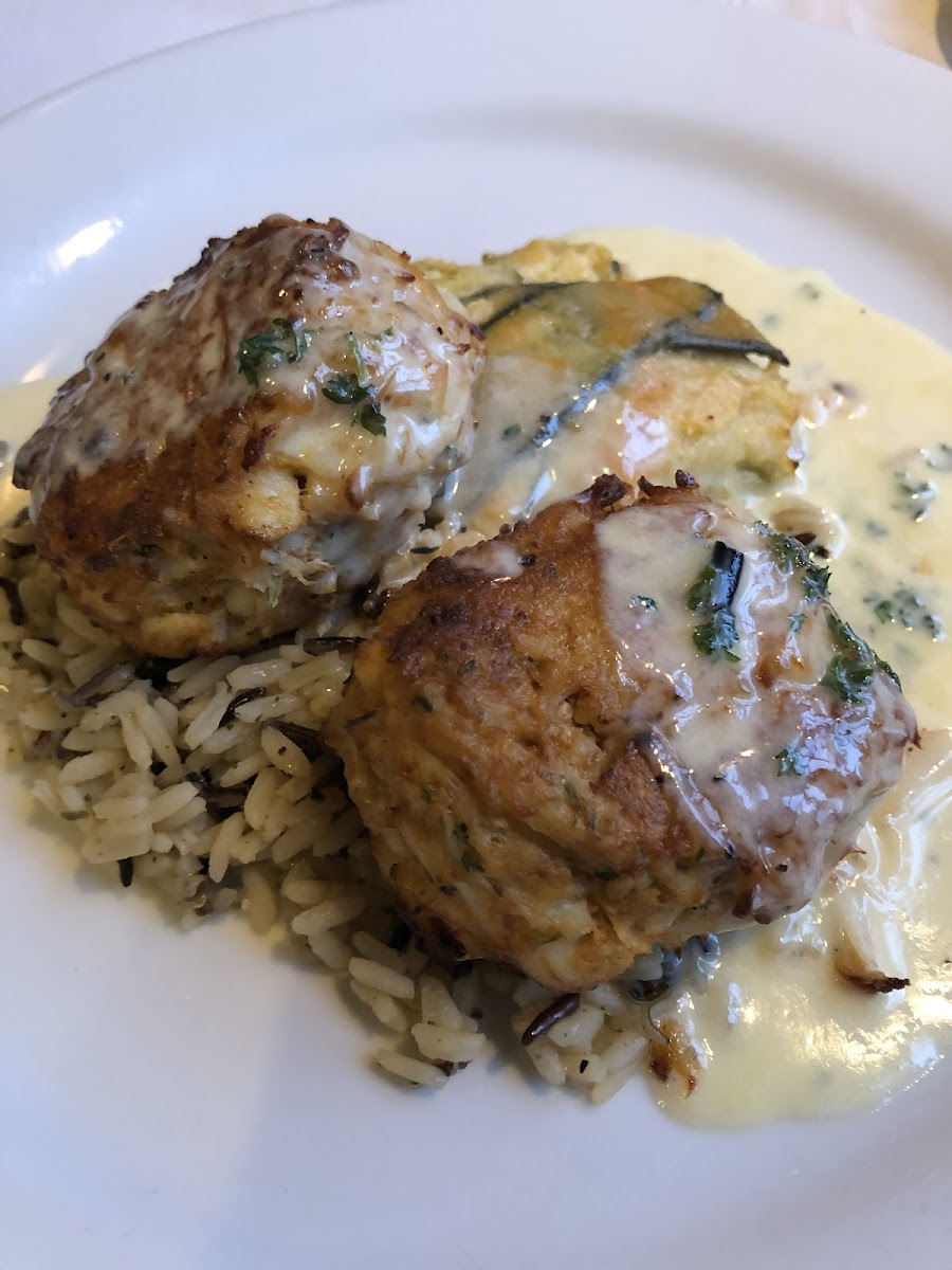 GF crab cakes with wild rice, and zucchini au gratin