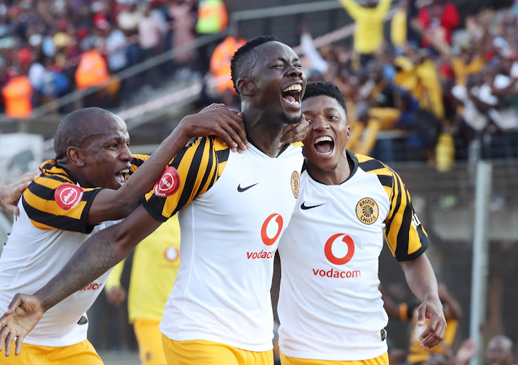 Mulomowandau Mathoho celebrates with teammates Lebogang Manyama and Dumisani Zuma of Kaizer Chiefs.