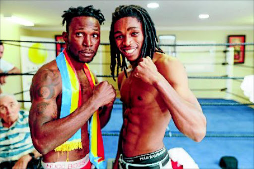 Congolese Eric Kapia Mukadi, left, and SA's Thulani Mbenge square off ahead of their fight for the vacant ABU welterweight belt, at Emperors Palace, on Thursday night. PHOTO: Nick Lourens