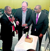 Sanabo president Andile Mofu,  Deputy Sports Minister Gert Oosthuizen and Sports Department director-general  Alec Moemi during the launch of the Open Boxing League in Tsakane on Saturday. /  Supplied