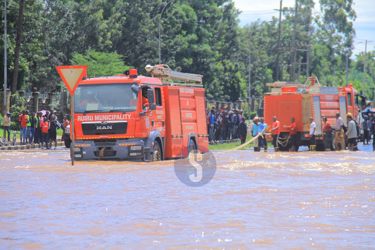A fire brigade vehicle wades through floodedsection of Thika Road at Jomo kenyatta University in a mission to pull out stalled vehicle on May 1, 2024.