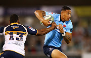 Israel Folau of the Waratahs runs the ball during the round seven Super Rugby match between the Brumbies and the Waratahs at GIO Stadium on March 31, 2018 in Canberra, Australia. 