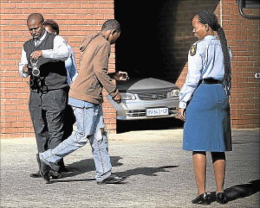 CASE CONTINUES: An accused in the gang-rape of a 17-year-old girl is seen outside the Roodepoort Magistrate's Court during a previous appearance. Photo: ALON SKUY