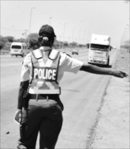 NO CHANCE: Police officers are implementing the zero tolerance strategy for negligent road users. Some were fined for breaking the law. Pic: ELIJAR MUSHIANA. 17/12/2009. © Sowetan.