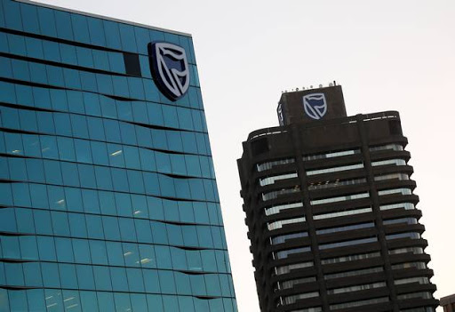 The logo of South Africa's Standard Bank is seen above the company's headquarters in Cape Town, South Africa May 6, 2016.