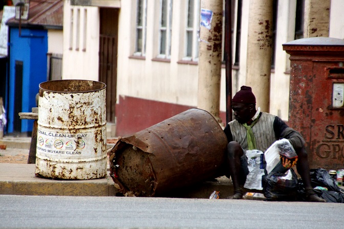 A homeless man searches for food in Mutare, Zimbabwe, during the country's national lockdown.
