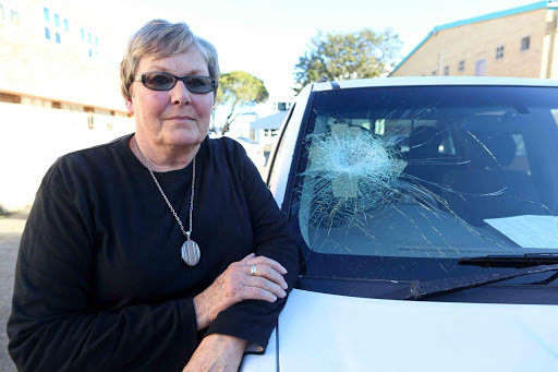 COURAGE: Phyl Schenk’s windscreen was smashed and the bodywork of her bakkie dented after she, her husband and a friend were brutally attacked at Gulu Mouth on Sunday afternoon after they interrupted a group of thugs attacking three people Picture: STEPHANIE LLOYD
