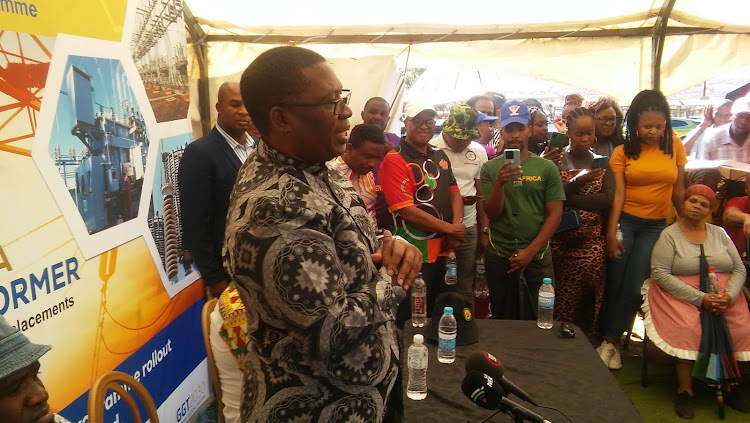 Gauteng premier Panyaza Lesufi speaks to Kagiso residents in Swaneville, West Rand, during the launch of an initiative aimed at restoring transformers in townships that have not had power for some time.