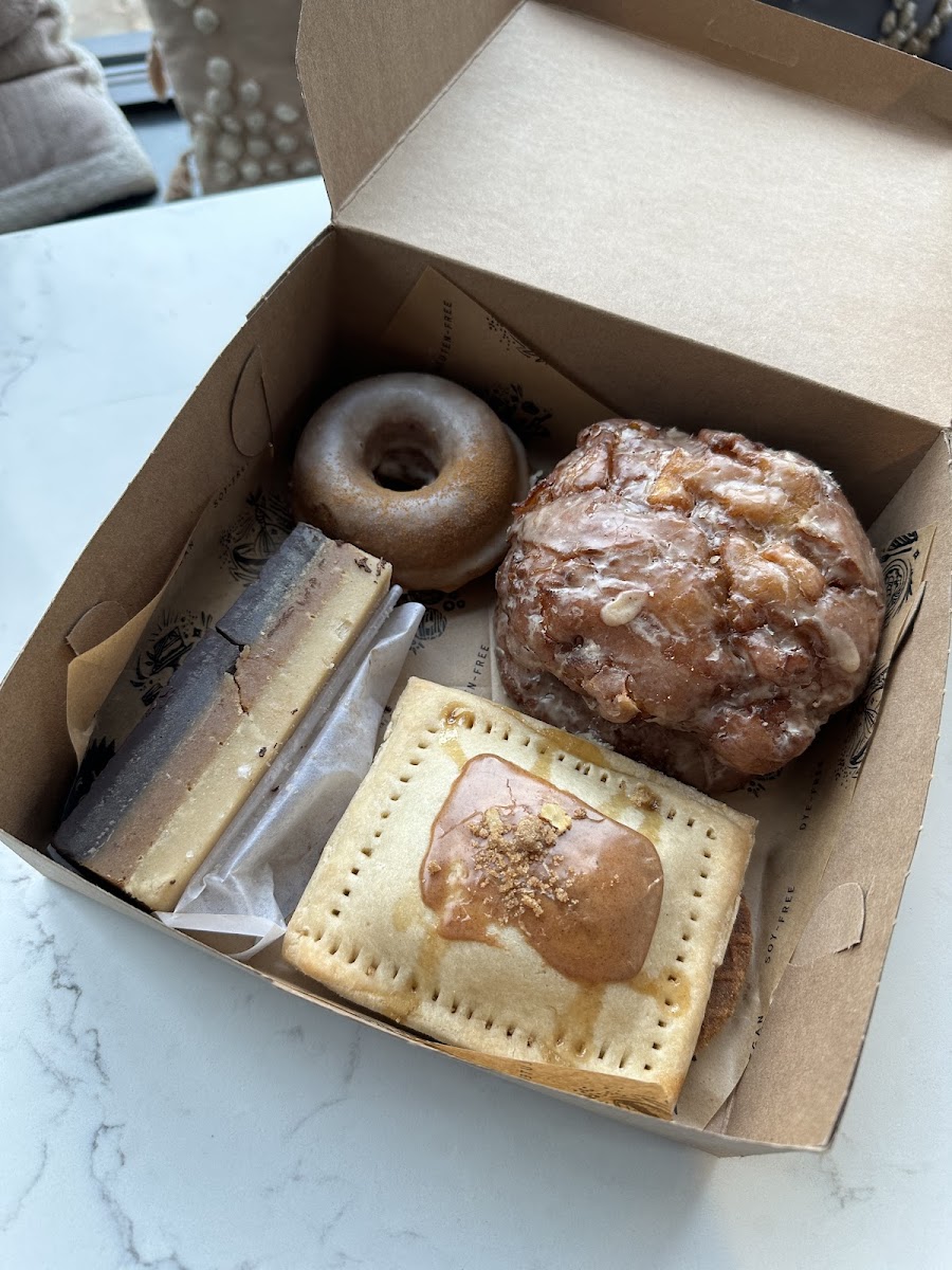 The most exciting pastry box - apple fritter! Donut, stroopwafel, yum tart, millionaire bar