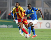 Aubrey Modiba of Mamelodi Sundowns is closely watched by Roger Aholou of Esperance on Saturday. 