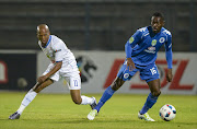 Aubrey Ngoma of Mpumalanga Black Aces and Dove Wome of SuperSport United during the Nedbank Cup Quarter Final match between SuperSport United and Black Aces at Lucas Moripe Stadium on April 22, 2016 in Pretoria, South Africa
