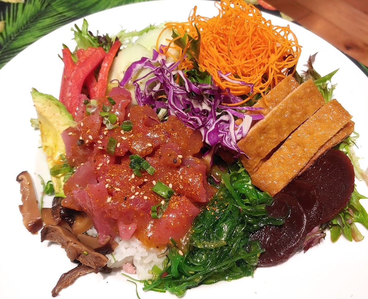 Ahu Tuna Poké Bowl: sushi rice | mixed greens | avocado | beets | carrots | cucumbers | inari nigiri | red cabbage | red peppers | seaweed salad | shiitake mushrooms.