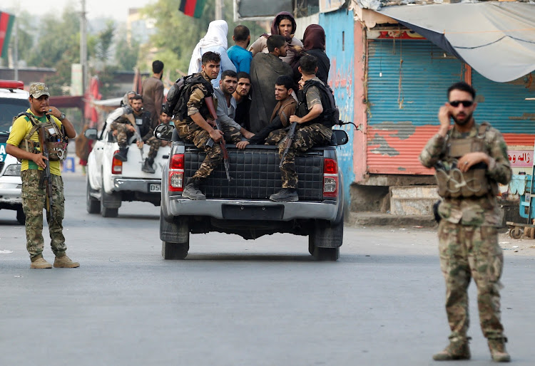 Afghan security forces transport detained prisoners who escaped from a jail after insurgents attacked a jail compound in Jalalabad, Afghanistan, August 3, 2020.