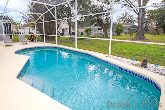 Enjoy a peaceful morning swim in the south-facing pool at this Kissimmee vacation villa