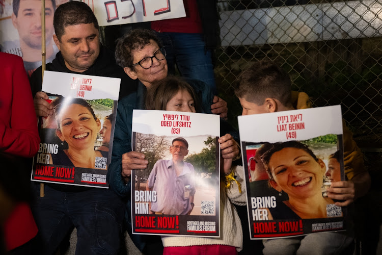 Yocheved Lifshitz, second left, who was kidnapped by Hamas on October 7 and was released on October 24, rallies for the release of all the hostages on November 28 2023 in Tel Aviv, Israel. Picture: GETTY IMAGES/ALEXI ROSENFELD