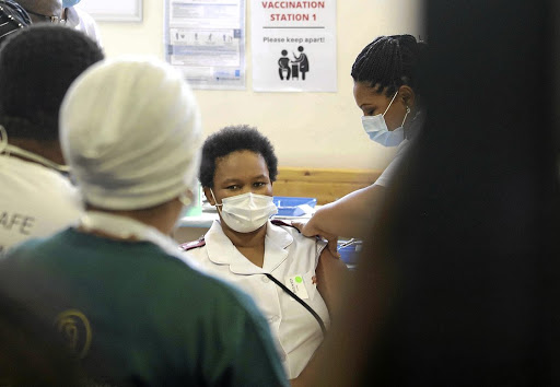 A nurse at the Khayelitsha District Hospital in Cape Town gets her Covid vaccine jab. File picture.