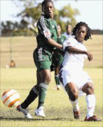 OPENER: Litha Ngxabi, left, scored the first goal of the game for Amazulu, sheilding the ball from Sibusiso Mahlangu. Pic. Mandla Mkhize. 21/01/2007. © Sowetan.