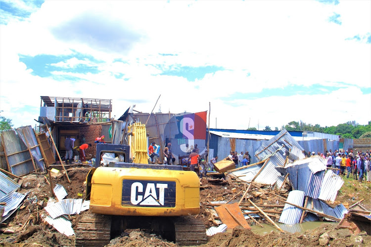 A KDF bulldozer demolishes structures along Nairobi River in Kaimaiko area on May 3, 2024.