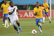 A file photo of former Bidvest Wits midfielder Tinashe Nengomasha (L) vying for the ball with Khama Billiat of Mamelodi Sundowns during the Absa Premiership match at Loftus Stadium on September 21, 2013 in Pretoria, South Africa.