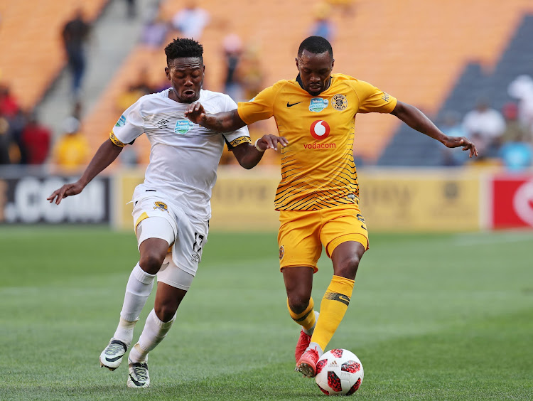 Kaizer Chiefs striker Bernard Parker shields the ball away from Lifa Hlongwane of Black Leopards during the Telkom Knockout Cup match at the FNB Stadium in Soweto, south west of Johannesburg, on October 21, 2018.