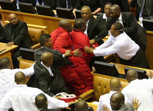 EFF members clash with parliament protection services during the State of the Nation Address Picture: ESA ALEXANDER
