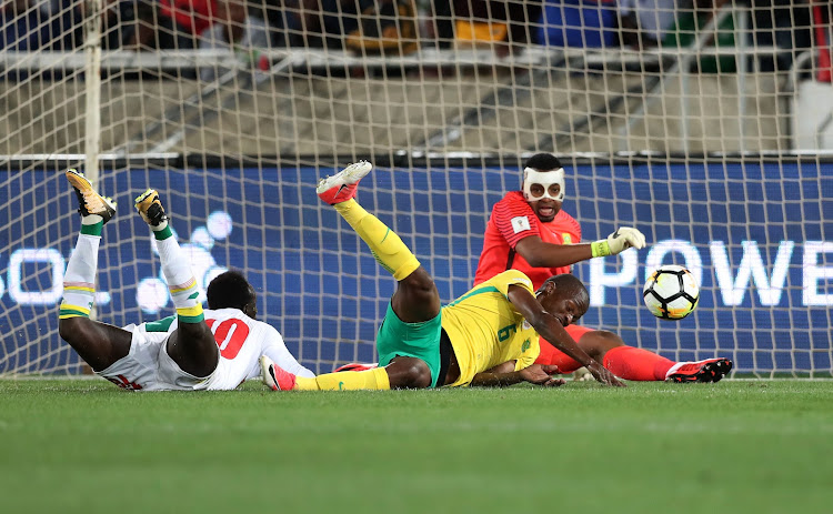 Thamsanqa Mkhize of South Africa scores own goal after shot from Sadio Mane of Senegal as Itumeleng Khune looks on during the 2018 World Cup qualifying football match between South Africa and Senegal at Peter Mokaba, Stadium, Polokwane, South Africa on 10 November 2017.