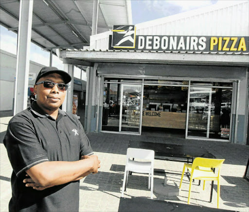 DINER DYNASTY: Sicelo Mntonga owns 11 fast food franchises in four towns in Eastern Cape and KwaZulu-Natal, and employs 350 people in these franchises Picture: LULAMILE FENI