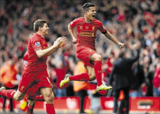 WINNER: Philippe Coutinho of Liverpool celebrates scoring his team's third goal against Manchester City Photo: Alex Livesey/Getty Images