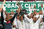 Free State Stars captain Paulus Masehe leads the celebrations after Ea Lla Koto broke their cup drought with the Nedbank Cup trophy at Cape Town Stadium at the weekend. 