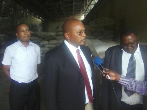 National Cereals and Produce Board chairman Geoffrey King'ang'i addresses the media at the go-down where stolen government subsidised fertilizer worth more than Sh4.5 million was recovered on Wednesday. Photo/Wanjiru Macharia